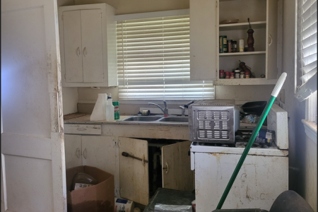 Photo of a filthy kitchen in disastrous condition